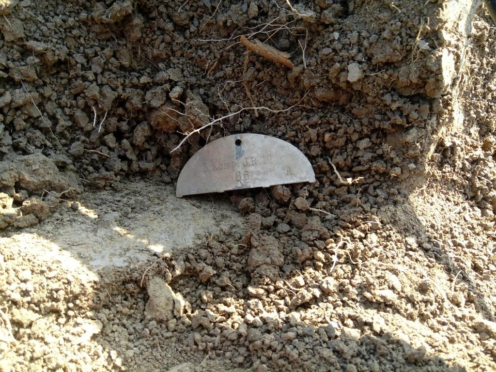 This half dog tag was found on a medical pit This half dog tag was found on a medical pit