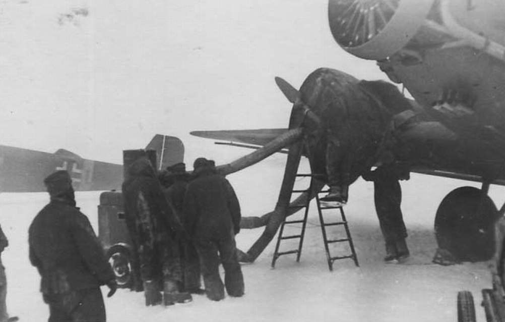 Warming up engines of Ju-52 with the help of an air heater at Pitomnik airfield. January 1943 Warming up engines of Ju-52 with the help of an air heater at Pitomnik airfield. January 1943