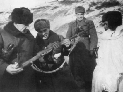 The commander of the 62nd Army Vasily Chuikov and a military council member Kuzma Gurov scrutinizing a rifle of a legendary sniper Vasily Zaytsev