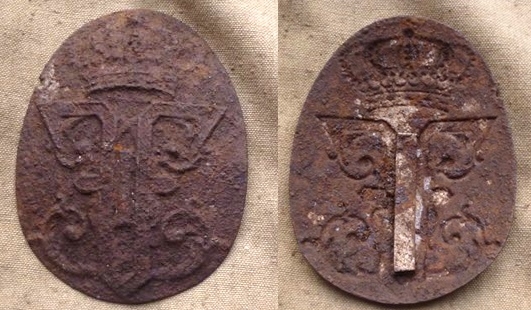 An emblem with a Ferdinand I monogram found during diggings. An emblem with a Ferdinand I monogram found during diggings.