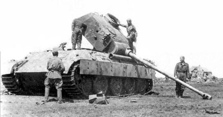 Red Army soldiers and a damaged German Panther tank.