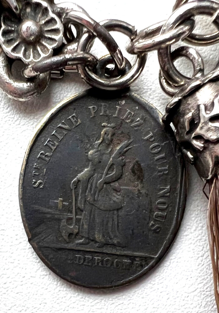 Chatelain with a Catholic pendant
