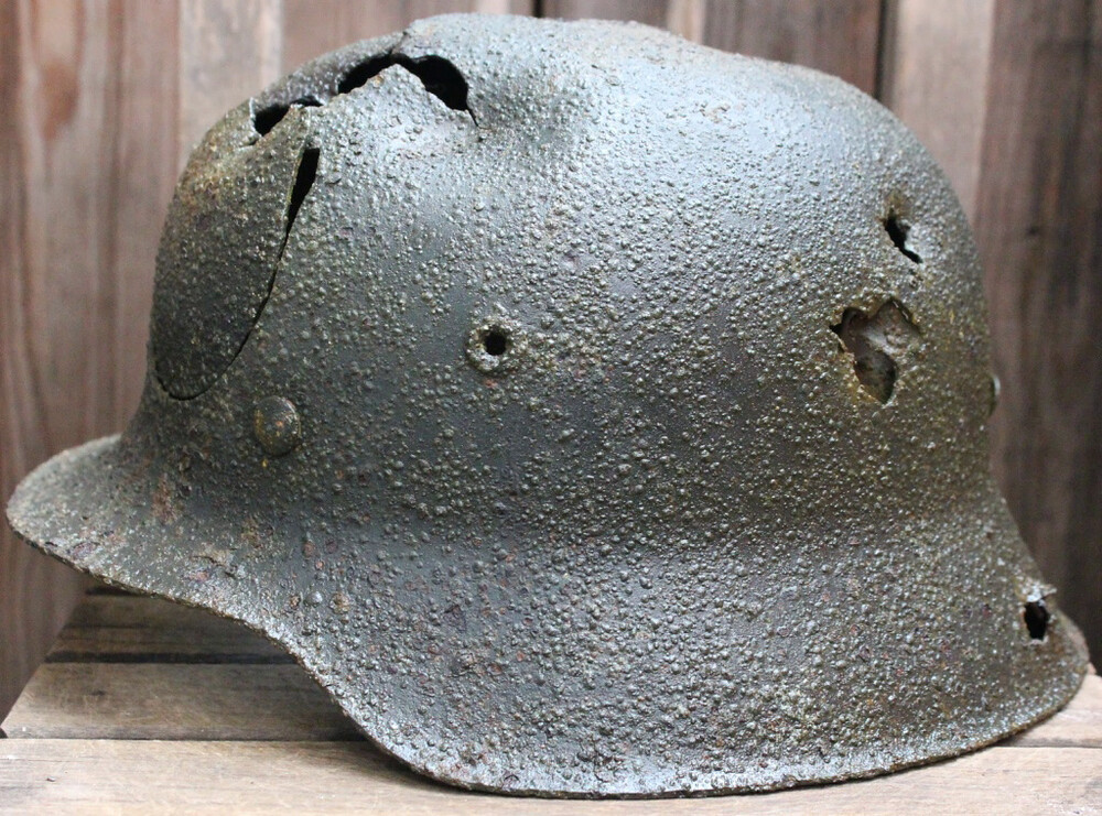 Waffen SS helmet M42 a piece of helmet falls out from Pskov