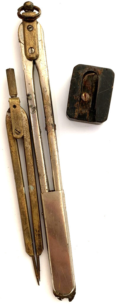 Compasses and a pencil sharpener