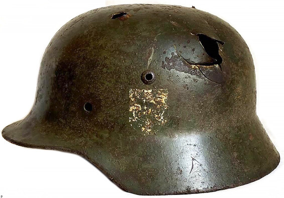 German helmet M35 DD with multiple bullet or shrapnel injuries from Rzhev