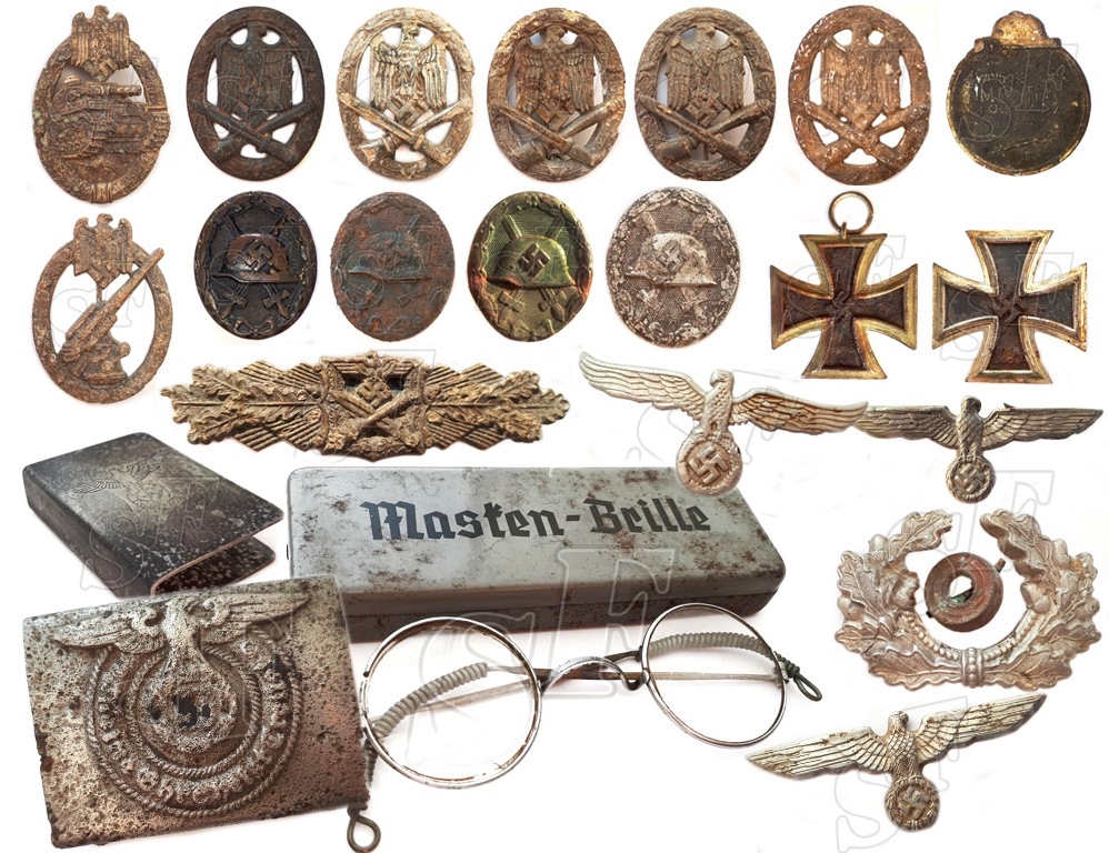 Badges found at the site where after the surrender there was a camp for German prisoners of war