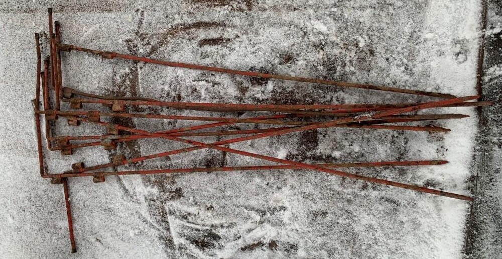 Pegs for attaching flags indicating minefields